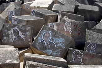 Painted portraits of famous musicians and composers on stone blocks