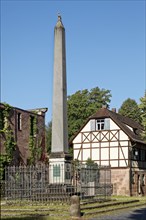 Obelisk with former coach house