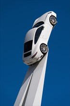 Porsche 911 Carrera 2015 on a white pedestal