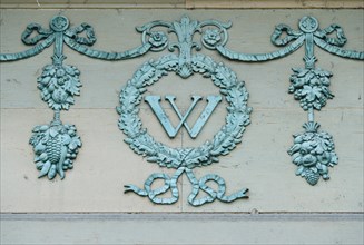 Ornamental frieze with capital W