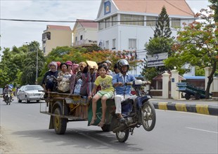 Man on scooter makes a wheelie