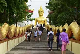 Tourists on stairs to Wat Phra Yai Temple
