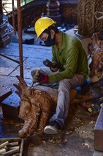 Craftsman carving a dragon figure in the Sanctuary of Truth Temple