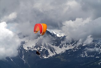 Paraglider in clouds over the Allgau Alps