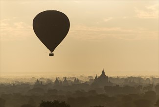 Hot-air Balloon in flight over temples of Bagan