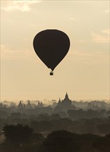 Hot-air Balloon in flight over temples of Bagan