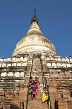Visitors climb steep steps of Shwesandaw Pagoda