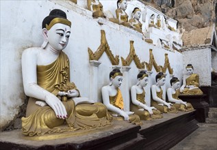 Line of Buddha statues at Kaw-goon