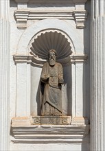 Apostle statue in a niche of the facade of St. Cajetan Church