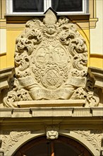 Baroque coat of arms over monastery gate