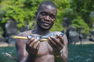 Local man holding fresh fishes