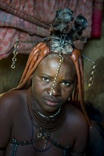 Friendly Himba woman in her hut