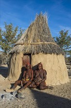 Himba women in front of their hut