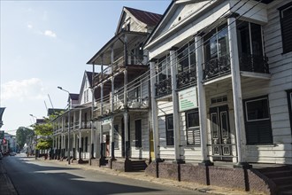 Street with dutch colonial wooden buildings
