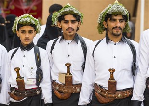 Traditional dressed men with with crooked dagger