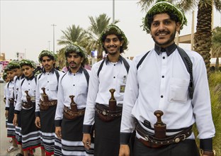 Traditional dressed men with with crooked dagger