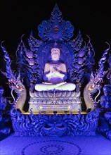 Blue Buddha Statue in the Garden of Wat Rong Seur Ten
