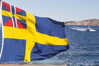 Flag of Sweden atop boat