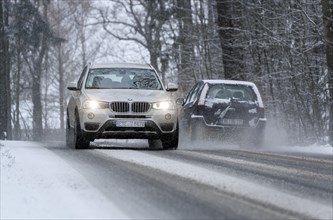 Snowy road with cars