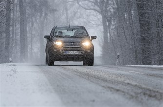 Snowy road with cars