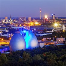 City view with the illuminated digesters of WWTP Dortmund Deusen II