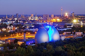 City view with the illuminated digesters of WWTP Dortmund Deusen II