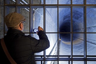 A man photographed in the tunnel tube