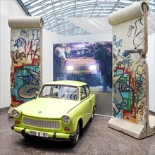 Original Berlin Wall with Trabi and film of the opening of the Berlin Wall in 1989
