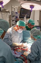Heart surgeon Prof. Richard Frey with team during a heart operation in the operating room