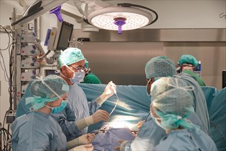 Heart surgeon Prof. Richard Frey with team during a heart operation in the operating room