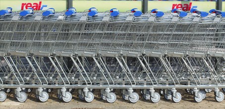Row of shopping carts in front of shopping centre