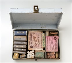Historical first aid kit with bandage and ampoules