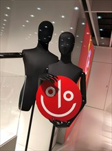 Mannequins with signs for discount