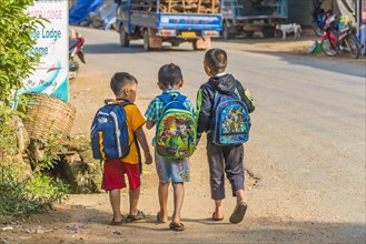 Three little boys going to school