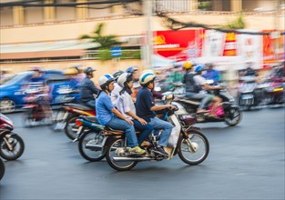 Scooter drivers in heavy traffic