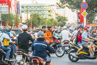 Crowd of scooter drivers in heavy traffic