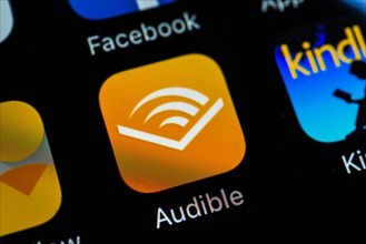 Smartphone screen with Audible app icon in detail