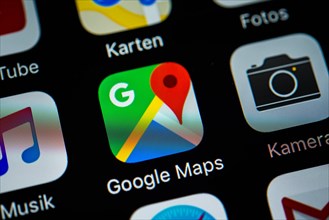 Smartphone screen displaying Google Maps and Camera apps in detail
