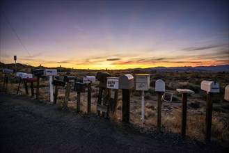Roadside mailboxes at sunset