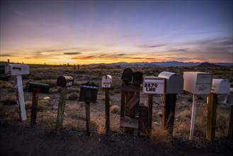 Roadside mailboxes at sunset
