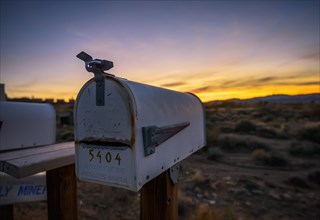 Roadside mailbox at sunset