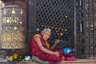 Old woman with prayer beads