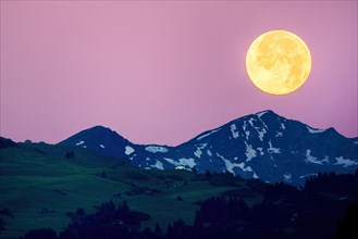 Big full moon over the Swiss Alps