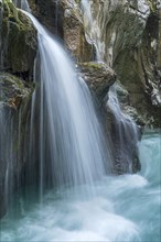 Waterfall on the emerald green wild river Soca