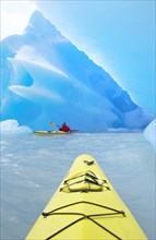 Kayaker heading for icebergs on Lago Grey