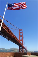 Golden Gate Bridge and the American flag Stars and Stripes
