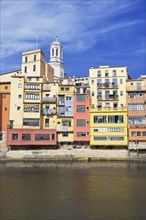 Colorful houses and Cathedral on the Onyar River