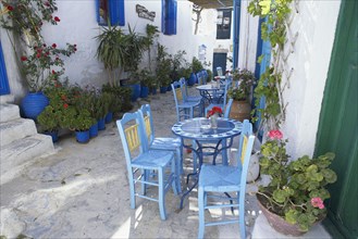 Streetside cafe with tables and chairs