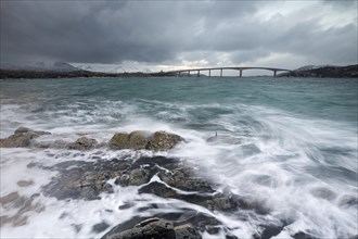Bad weather and stormy sea with car bridge to Sommaroy