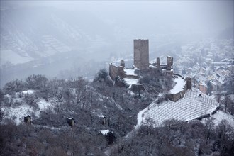 Niederburg castle ruins in winter with snowfall